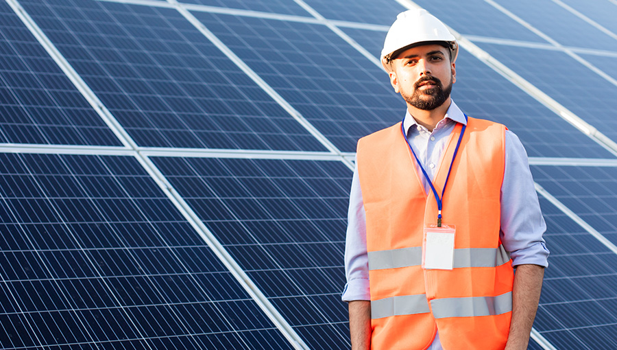 contractor next to a PV roof