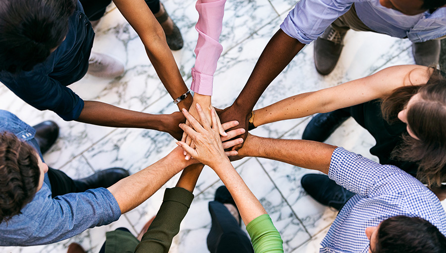 group putting their hands together